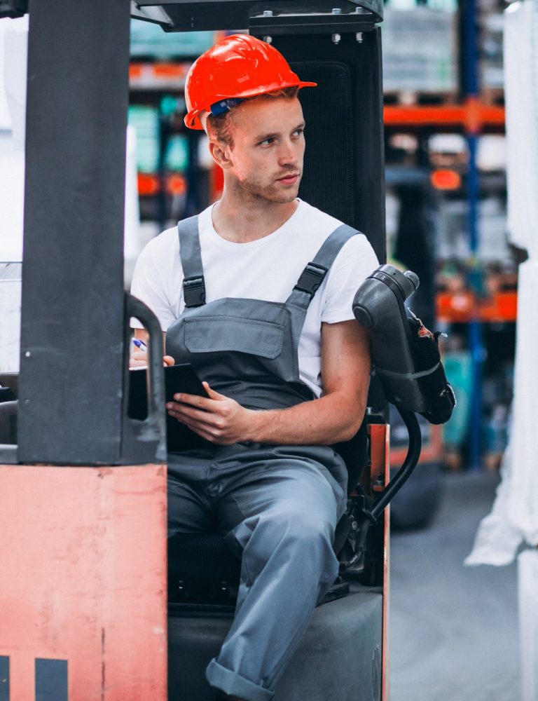 young-man-working-warehouse-with-boxes